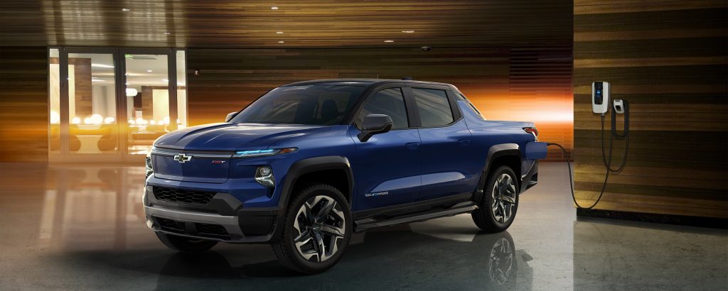 Blue Chevrolet Silverado EV charging at indoor station