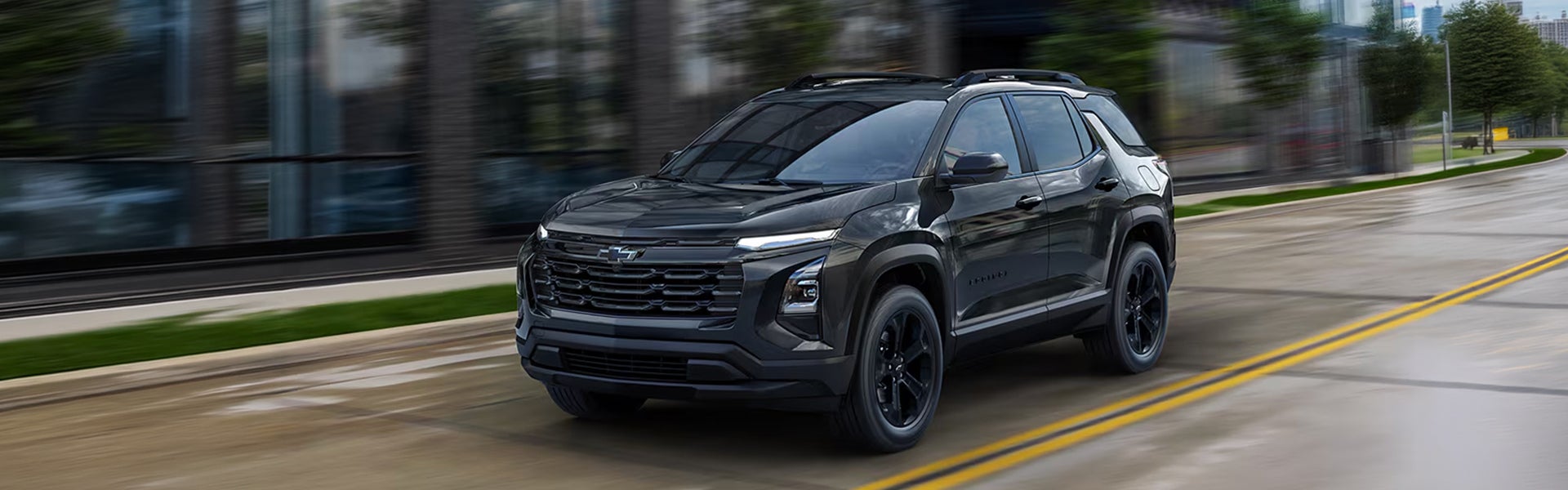 Chevrolet Equinox driving through a city street.